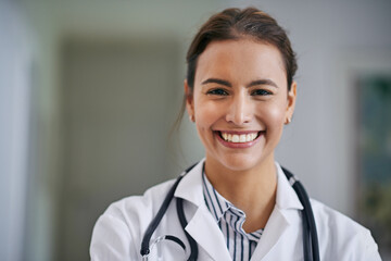 The smile that puts every patient at ease. Portrait of a cheerful young doctor at work.