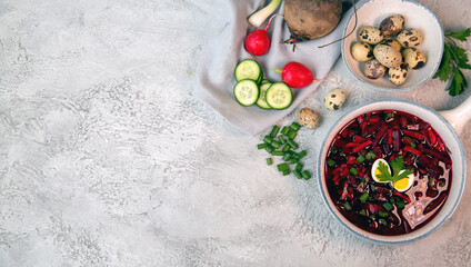 Cold beetroot soup with vegetables, eggs, herbs. Traditional cuisine. Healthy food. Vegetarian food.