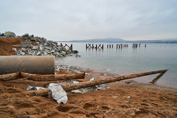 Image of sewer pipes on the seashore.