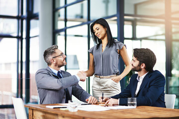 I look forward to transforming business together. Cropped shot of businesspeople shaking hands...