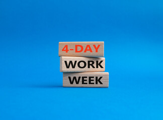 4-day work week symbol. Concept words 4-day work week on wooden blocks. Beautiful blue background. Business and 4-day work week concept. Copy space
