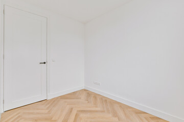 Corner of the empty white room with door
