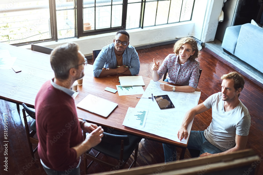 Aufkleber preparing his team for the busiest time of the year. shot of a creative business team having a meeti