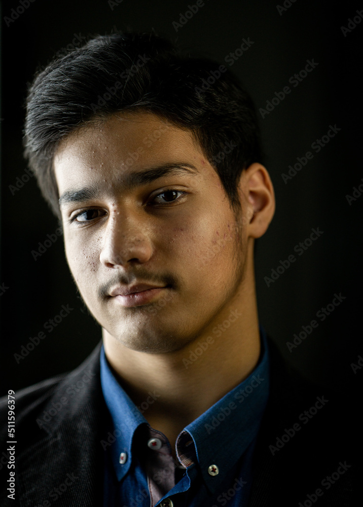 Wall mural Portrait of real happy mixed race teenager smiling. High quality photo