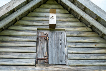 Stable and pigsty made of wooden logs. Old wooden buildings in the countryside