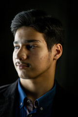 Fototapeta premium Portrait of real happy mixed race teenager smiling. High quality photo