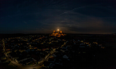 Image of illuminated Muenzenberg castle ruin in Germany in the evening
