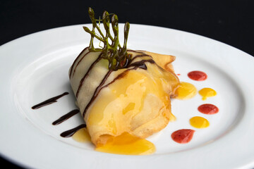 Crepes served on a white plate, sweet dessert for breakfast, professional food presentation, exclusive event meal.