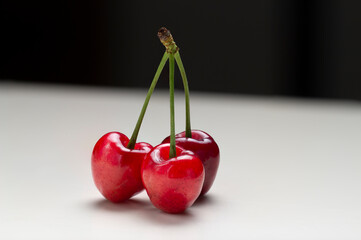 sweet cherry berry isolated on white and black background