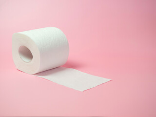 Toilet paper roll on pink background, Space for text