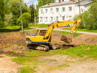 Excavator earthworks. The work of construction equipment in the production of earthworks.yellow...