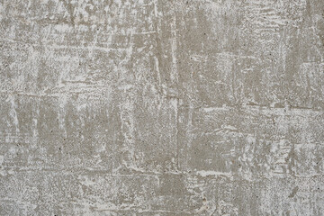 Abstract background and texture old concrete wall with peeling and weathered lime.