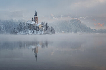 Lake Bled with the church and the castle on a calm winter morning