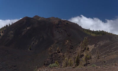 La Palma, long-range popular hiking route Ruta de Los Volcanes, landscapes around 
black crater of El Duraznero volcano, formed in 1949