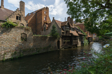Fototapeta na wymiar Beautiful canal and traditional houses near Bonifazius Bridge in the old town of Bruges, Belgium