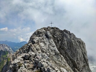 Naklejka na ściany i meble summit cross on the altmann in the appenzell alps. High quality photo.