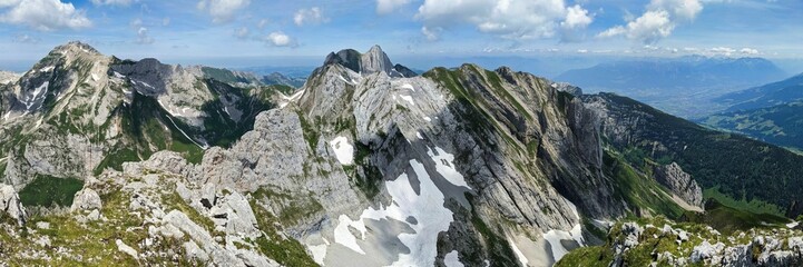 Fototapeta na wymiar large mountain panorama on the wildhuser schofberg. wanderlust. Hiking in the Alpstein area. High quality photo.