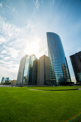 Fototapeta premium Glass of modern tower. Business and finance background of building. Skyscraper Business Office building. Skyscraper's exterior. high building financial business area with cloud blue sky. Paris. 