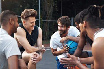 Lets get out there and win this one. Shot of a group of sporty young men chatting to each other on a basketball court.