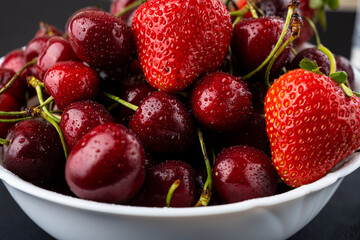Strawberries and cherries in a bowl. Fresh fruits. juicy berries