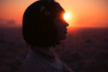 Desert in Egypt. Girl portrait in egypt style clothes. Sunset. Close-up
