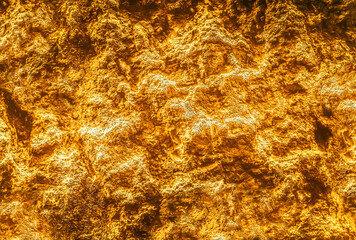 Rock texture. Gold texture. Golden Ore rocks. Stone background. Abstract texture. Rock pile. Stone texture. Structure. Shimmering surface. Precious Foil. Rough structure mineral.