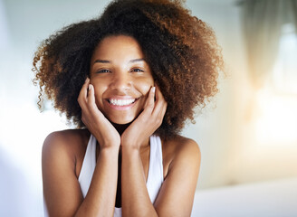 Gorgeous skin and a gorgeous smile. Portrait of an attractive young woman going through her morning beauty routine.