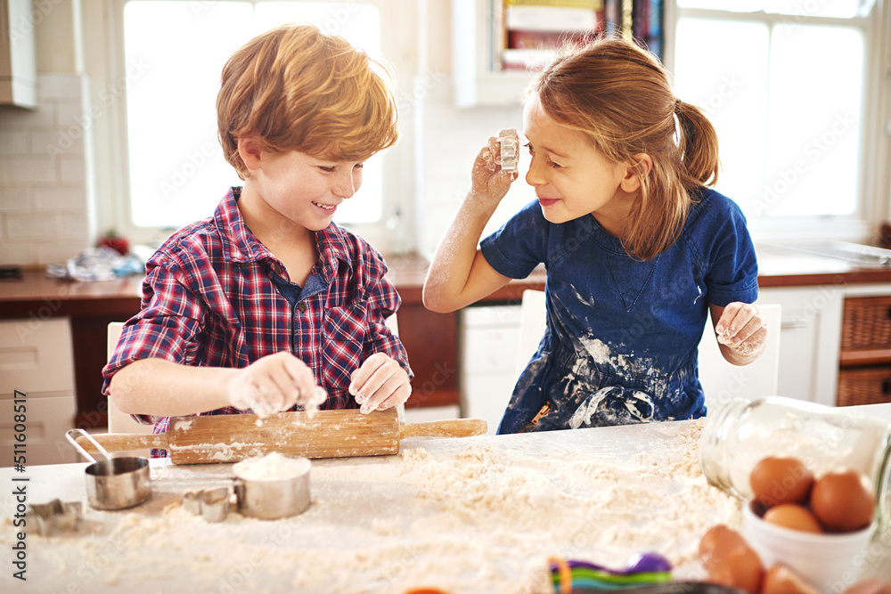 Poster I see you. Cropped shot of two young children having fun while baking together at home.