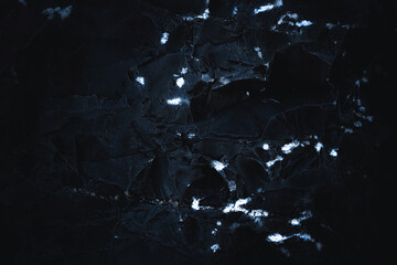 Grunge Rough structure. Black texture. Stone background. Dark marble. Rock texture. Rock surface with cracks. Rock pile. Paint spots wall. Abstract texture.