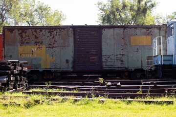 Fototapeta na wymiar abandoned rusty old train wagon