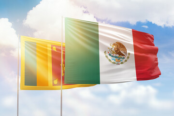 Sunny blue sky and flags of mexico and sri lanka