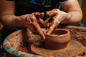 Potter at work. Workshop place.