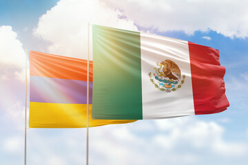 Sunny blue sky and flags of mexico and armenia