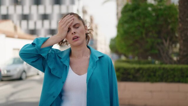 Young woman sweating standing at street