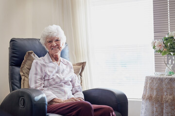 I sure am glad I planned for a relaxing retirement. Portrait of a happy elderly woman relaxing on a...
