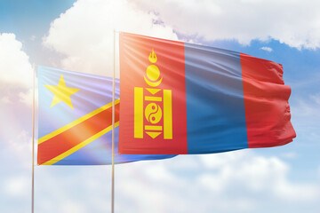 Sunny blue sky and flags of mongolia and dr congo