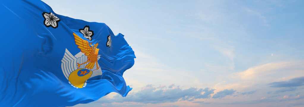 Official Flag Of Air Defense Command Of The Air Self Defense Force, Japan At Cloudy Sky Background On Sunset, Panoramic View. Japanese Travel And Patriot Concept. Copy Space For Wide Banner