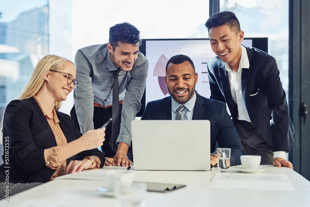 Poster get the team together and get it done. shot of a group of young businesspeople using a laptop during