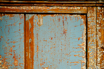 Distressed antique painted wood with cracked finish and worn weathered paint texture