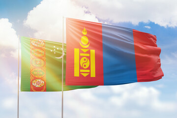 Sunny blue sky and flags of mongolia and turkmenistan
