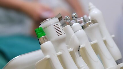 Medical device for skin care. Preventive medicine. Skin rejuvenation therapy. Hardware procedure in cosmetology. Close-up. Non-surgical facelift in a beauty clinic. Microcurrent treatment.
