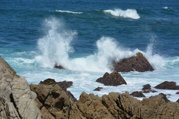 waves crashing on rocks