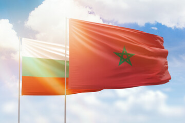 Sunny blue sky and flags of morocco and bulgaria