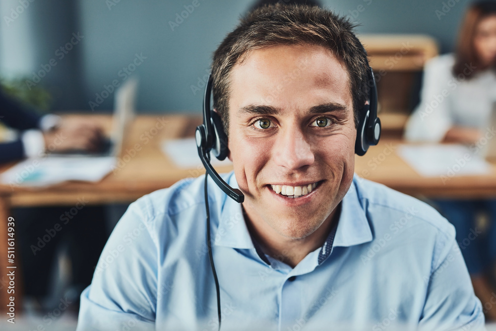 Poster he will help you over the phone. portrait of a focussed young man talking to a customer over the pho