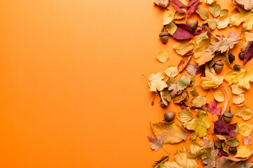 Autumn composition. Pattern made of dried leaves and other design accessories on table. Flat lay, top view