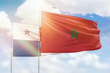 Sunny blue sky and flags of morocco and panama