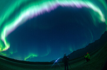 People taking photos of Aurora in Alaska