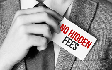 Closeup on businessman holding a card with text NO HIDDEN FEES