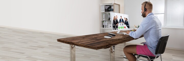 Businessman Attending Video Conference On Computer