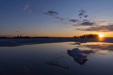 Beautiful Sunset over a Partially Frozen Astotin Lake